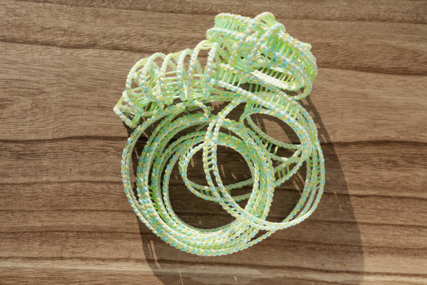 top view green plastic clothesline on a wood table