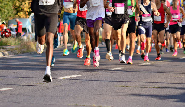 Marathon Runners, Multiracial Group of Competing on the streets of Budapest, Hungary. running stock pictures, royalty-free photos & images