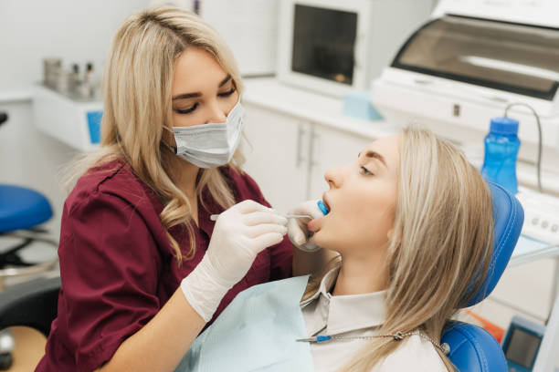 istock Dentist examining a patient's teeth in the dentist. 1921762244
