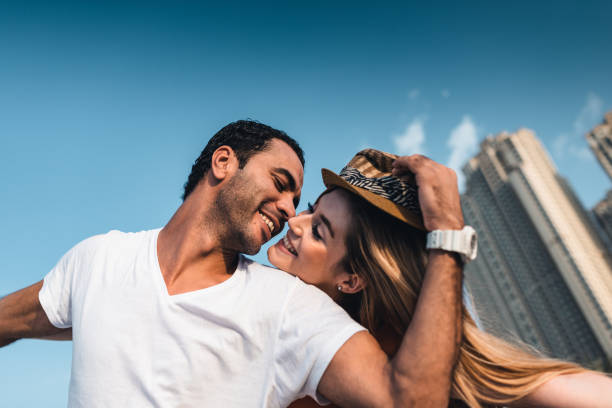 istock couple together at the beach in Dubai 1921767049