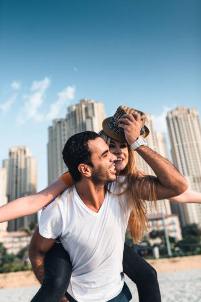istock couple together at the beach in Dubai 1921767639