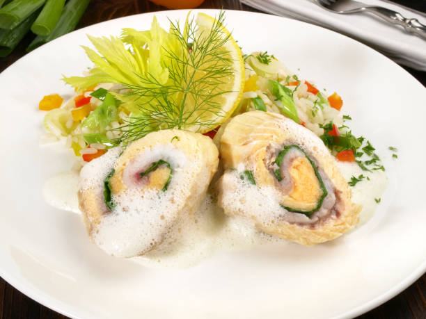 istock Salmon Rolls with Foam Sauce - Fish Fillet with Rice and Vegetables 1921769010