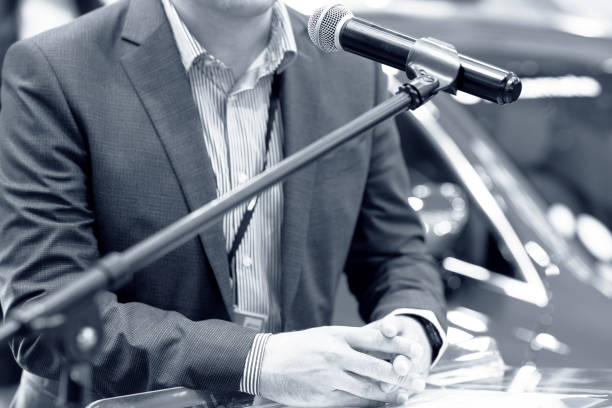 istock Speaker at business conference, corporate presentation, workshop, coaching training, news conference, company meeting, public or political event. Public speaking concept. 1921788109