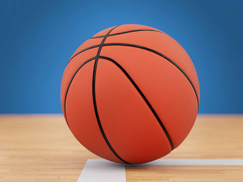 Orange Basketball Ball on Wooden Parquet. 3D Render