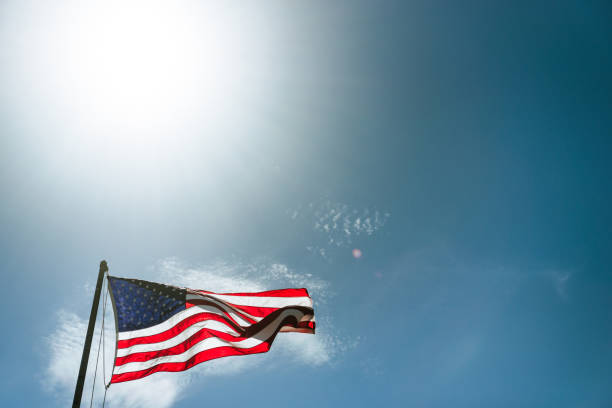 istock us flag waving in the sky 1921794576