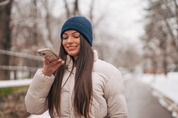 istock young woman talking on mobile phone 1921795663