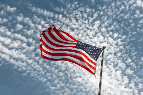 Free Stock Photo of American flag waving under blue sky with clouds ...