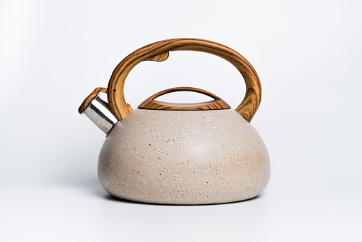 Kettle with handle on white background.