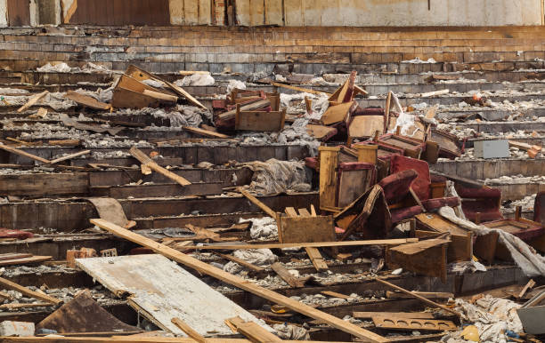 istock Broken chairs in pile of garbage in an abandoned building 1921851482
