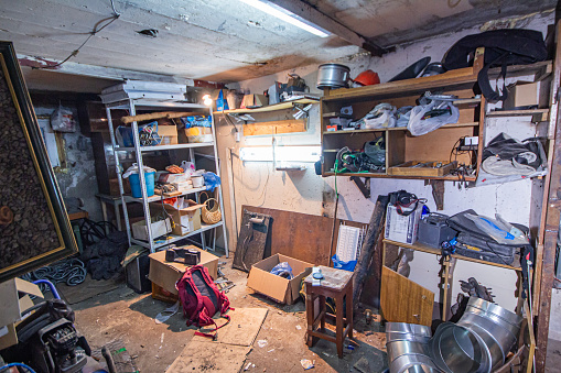 a big mess in the garage from rubbish, dismantling abandoned containers after a long period of inactivity without paying rent at auction