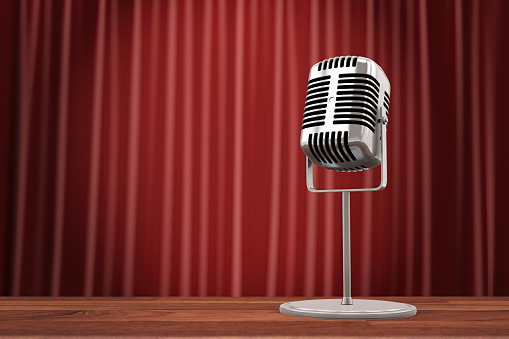 Vintage Microphone Against a Red Curtain. 3D Render