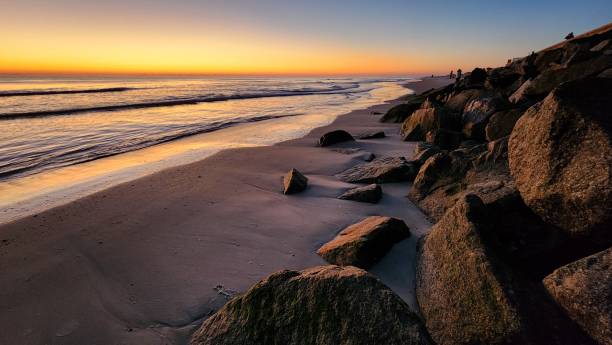 istock Breathtaking view of an ocean beach at sunset 1921864354