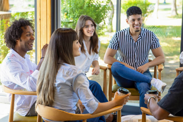 istock Group of People sitting in the circle at Psychotherapy talking about their issues. 1921890547