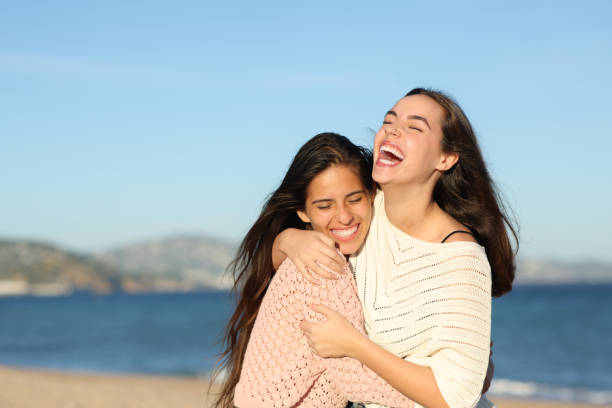 istock Happy friends hugging laughing very funny 1921903100