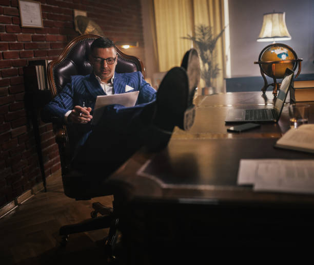 istock shot of a young businessman looking stressed while working in a office 1921937733