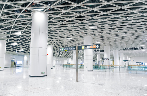 Hong Kong - May 22, 2023 : People at the Hong Kong International Airport. The airport has been commercially operational since 1998. It is operated by the Airport Authority Hong Kong.