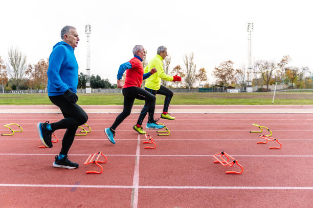 istock Active Senior Men Performing Agility Drills on Track 1921944563