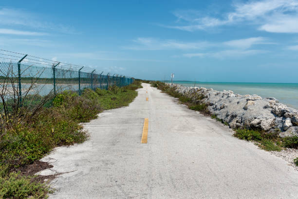 Sparsely traveled road next to beach on Key West