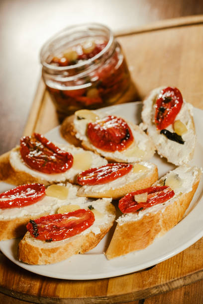 istock sandwiches with sun-dried tomatoes and cheese on a plate on the table 1921949387