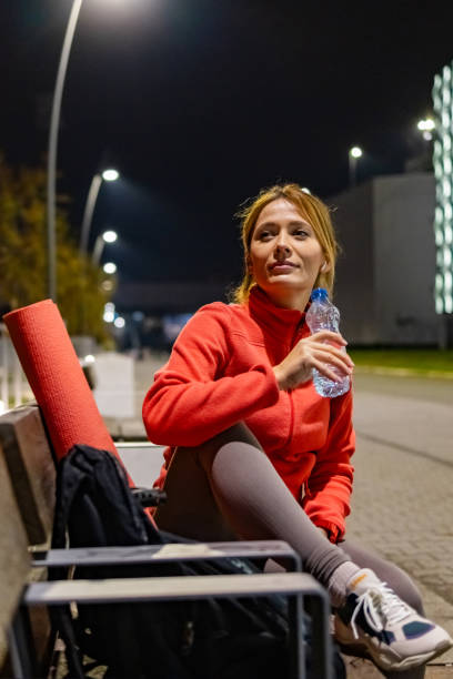 istock One athletic woman resting on bench after training in public park 1922000356