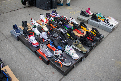 nyc, United States – January 07, 2024: A vibrant street scene with a variety of colorful sneakers being sold in New York, United States