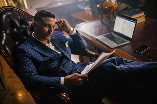 istock shot of a young businessman looking stressed while working in a office 1922015222