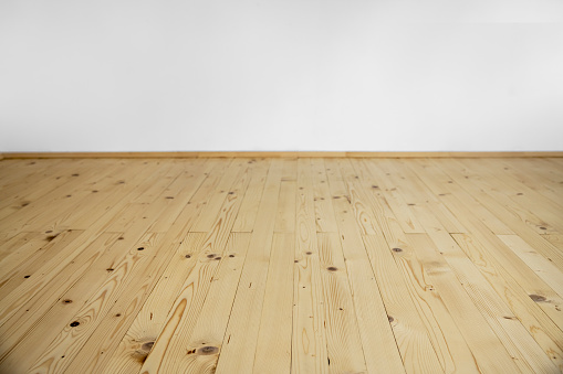 New wooden floor made of wooden planks in natural colors