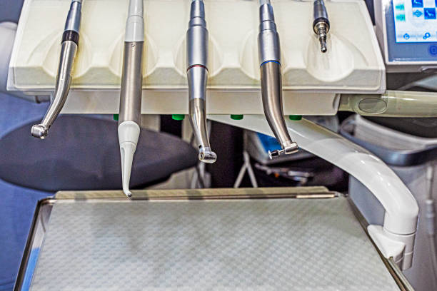 modern nozzle on a machine for drilling teeth on a light background. Dental care and treatment dentistry