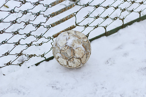 Ball snow near the fence.