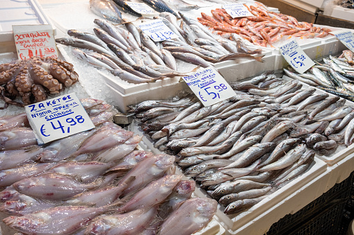 Fresh seafood including fish and shellfish displayed on ice in Borough Market in London, England