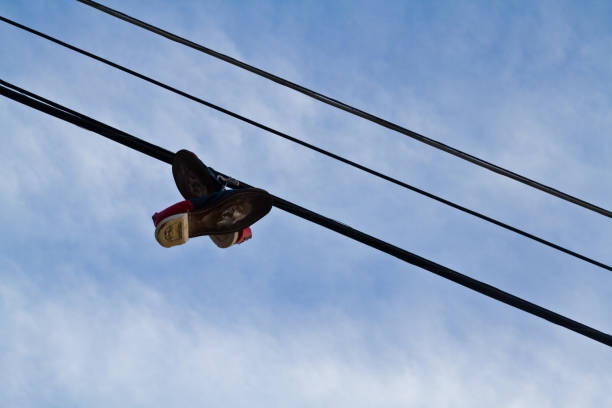 Palermo, Sicily, Italy Sneakers thrown over power lines in the street.