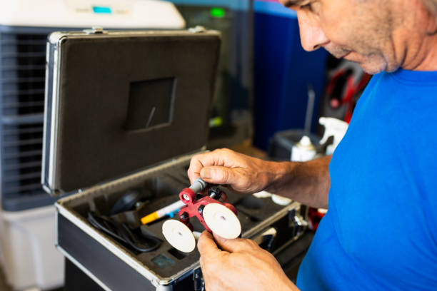 Auto mechanic working on car broken engine in mechanics service or garage. High quality photo