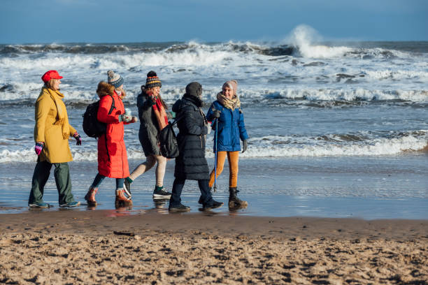 istock Walking by the Sea with Friends 1922134170