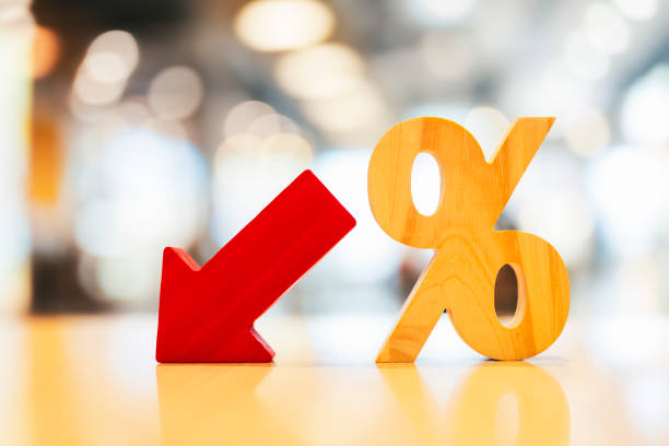 istock Percentage model and a red arrow pointing down symbolizes falling currency and falling interest rates, concepts of inflation and deflation. 1922144977