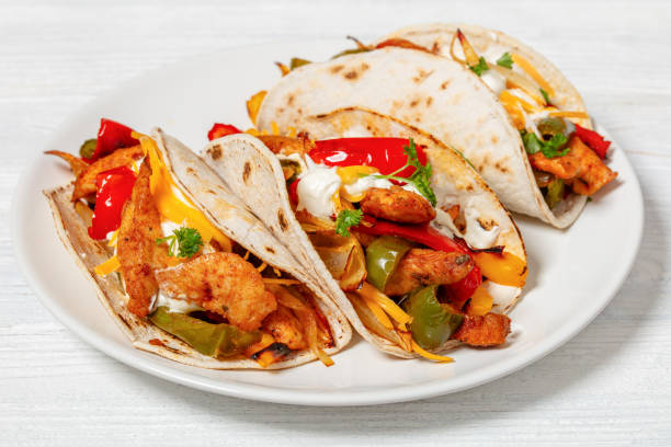 istock baked tex-mex chicken fajitas on a plate, top view 1922153581
