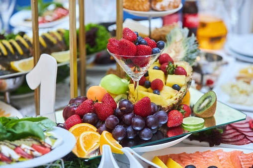 A dish with different types of fruits. Festive treats, spectacular presentation and food style.