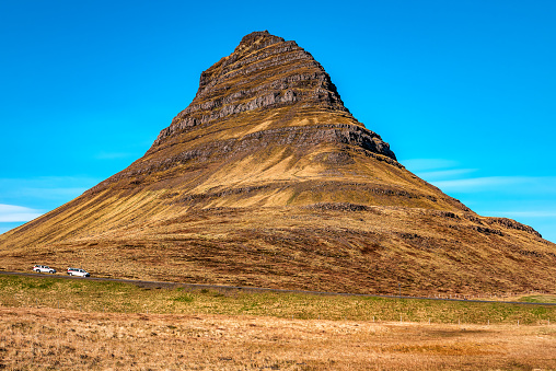 Close up of Moody Kirkjufell mountain peak in sunny day in Iceland. Travel theme