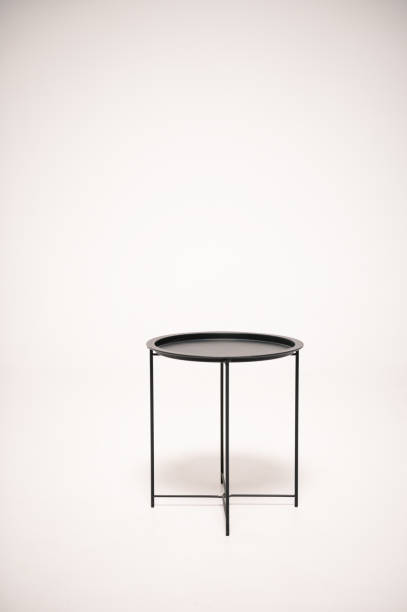 istock Metal black round coffee table isolated on a white background. Stylish coffee table in loft style on a white background. 1922190305