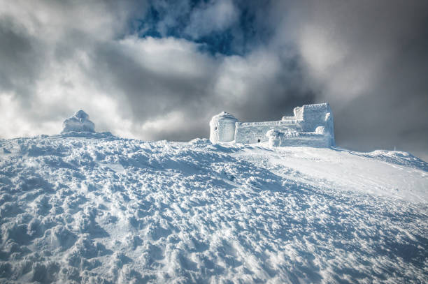 Ancient abandoned snow-covered observatory on the mountain Pip Ivan, called White Elephant in the Carpathian mountains. Winter time