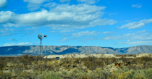 NEW MEXICO, USA - NOVEMBER 22, 2019: Small wind generator and solar panel in a Guadalupe mountain valley in New Mexico, USA