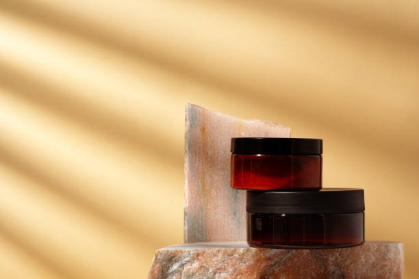 istock Cosmetic product jar in composition with granite stones and shadow 1922197362