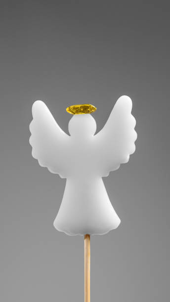 istock A white angel lollipop on a gray background. Holiday. 1922203809