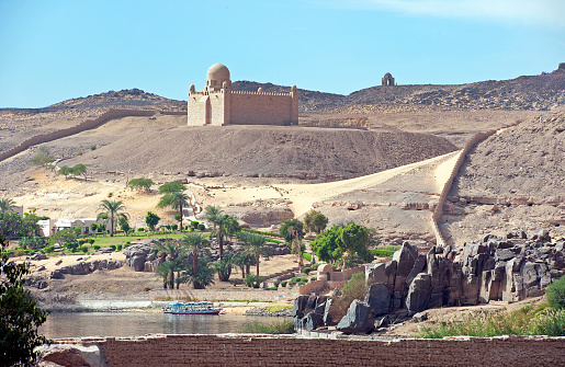 An arab man and his son sitting in Edge of the world, a natural landmark and popular tourist destination near Riyadh -Saudi Arabia.08-Nov-2019. Selective focus and background blurred.