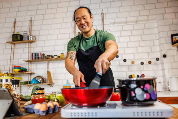 istock Handsome man makes cooking at home 1922218727