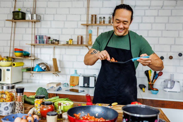istock Smiling Chinese chef tasting food 1922222691