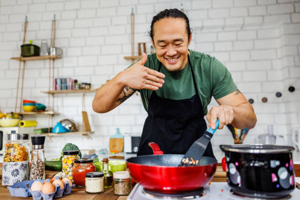istock Smiling Chinese chef smells food 1922222918
