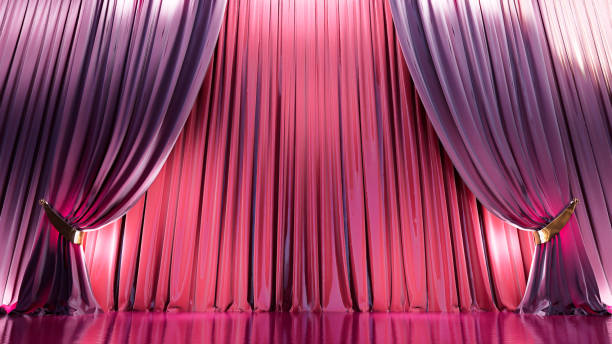 istock Empty theater stage with red and move velvet curtains 1922223448