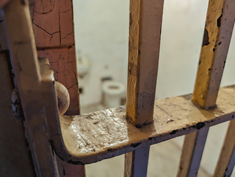 The old metal bars of a door in a prison
