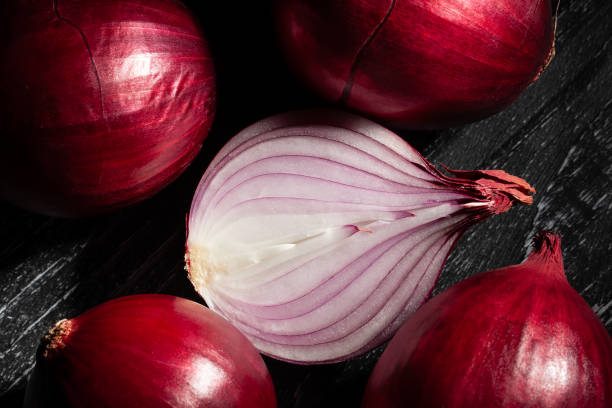 istock sliced red onion on wood 1922248056