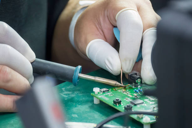 istock Close up scene the soldering operation by skill operator with rubber finger cot. 1922310694